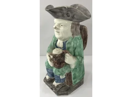 A late 18th Century Ralph Wood type cream ware Toby jug